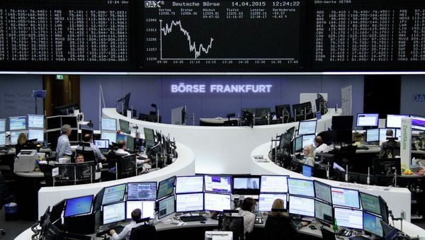 Traders are pictured at their desks in front of the DAX board at the Frankfurt stock exchange April 14, 2015 Traders are pictured at their desks in front of the DAX board at the Frankfurt stock exchange April 14, 2015 - Sputnik International