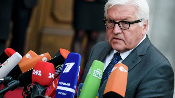 German Foreign Minister Frank-Walter Steinmeier speaks to journalists prior to a meeting of foreign ministers to examine the implementation of the Minsk peace accords German Foreign Minister Frank-Walter Steinmeier speaks to journalists prior to a meeting of foreign ministers to examine the implementation of the Minsk peace accords - Sputnik International
