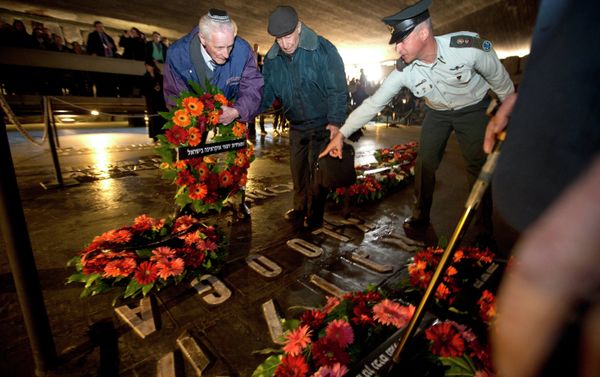 Holocaust survivors and their relatives lay a wreath next to the names of concentration camps during a ceremony marking the annual Holocaust Remembrance Day at the Hall of Remembrance at the Yad Vashem Holocaust memorial, in Jerusalem Holocaust survivors and their relatives lay a wreath next to the names of concentration camps during a ceremony marking the annual Holocaust Remembrance Day at the Hall of Remembrance at the Yad Vashem Holocaust memorial, in Jerusalem - Sputnik International