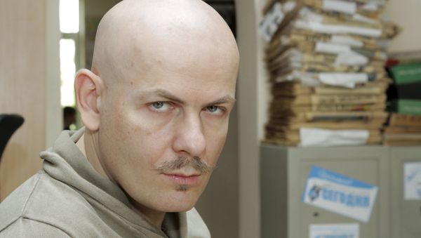 Journalist Oles Buzina looks on at the office of Sevodnya daily newspaper in Kiev in this October 12, 2012 file photo. - Sputnik International