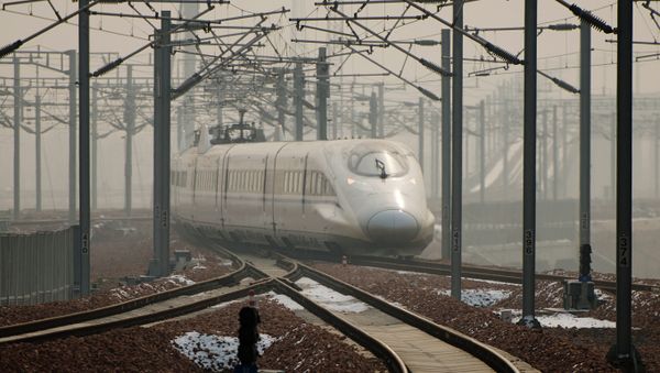 A high-speed train departs a platform in Hebei province south of Beijing on December 22, 2012 A high-speed train departs a platform in Hebei province south of Beijing on December 22, 2012 - Sputnik International