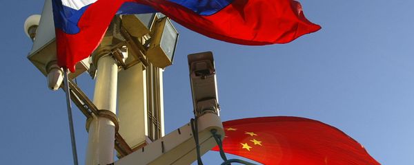 A worker places the Russian and Chinese flags outside Tiananmen Gate A worker places the Russian and Chinese flags outside Tiananmen Gate - Sputnik International
