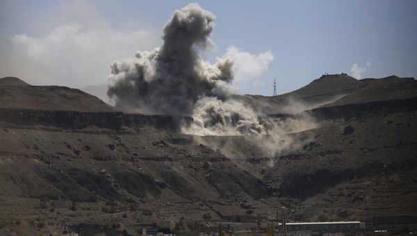 Dust rises from the site of army weapons depots hit by an air strike in Sanaa - Sputnik International