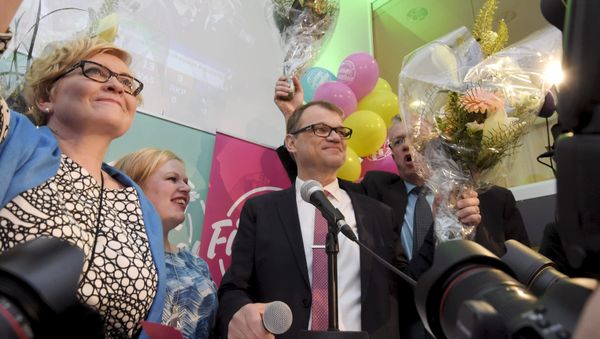 Anu Vehvilainen (L), Annika Saarikko, Chairman Juha Sipila and Juha Rehula of the Centre Party celebrate at the party's parliamentary elections reception in Helsinki after the results of the votes - Sputnik International