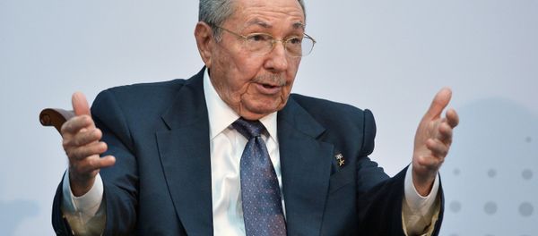 Cuba's President Raul Castro speaks with US President Barack Obama (out of frame) on the sidelines of the Summit of the Americas at the ATLAPA Convention center on April 11, 2015 in Panama City - Sputnik International
