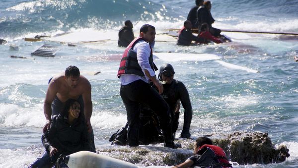 Migrants, who are trying to reach Greece, are rescued by members of the Greek Coast guard and locals near the coast of the southeastern island of Rhodes April 20, 2015 Migrants, who are trying to reach Greece, are rescued by members of the Greek Coast guard and locals near the coast of the southeastern island of Rhodes April 20, 2015 - Sputnik International