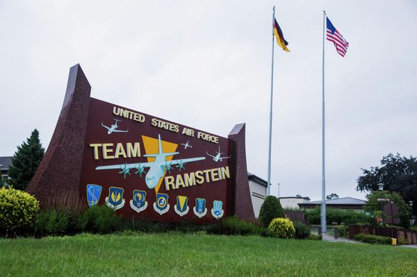 The flags of the United States and Germany fly behind a sign at Ramstein Air Base, Germany. The flags of the United States and Germany fly behind a sign at Ramstein Air Base, Germany. - Sputnik International