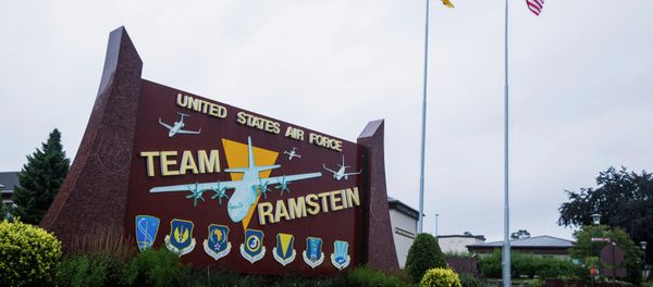 The flags of the United States and Germany fly behind a sign at Ramstein Air Base, Germany. The flags of the United States and Germany fly behind a sign at Ramstein Air Base, Germany. - Sputnik International