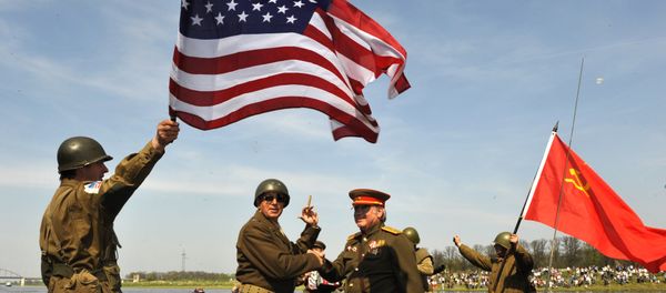 Amateur actors re-enact the linkup of Soviet and American troops 65 years ago, in Torgau, eastern Germany, on Saturday, April 24, 2010 - Sputnik International