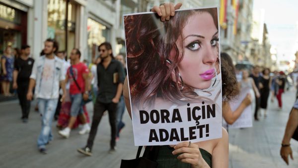 People march with a photograph of Dora Oezer, a transsexual Turkish woman, who according to local media was killed in Kusadasi, to protest violence against members of the gay and transsexual community members, in Istanbul, Turkey, Friday, July 12, 2013. File Photo People march with a photograph of Dora Oezer, a transsexual Turkish woman, who according to local media was killed in Kusadasi, to protest violence against members of the gay and transsexual community members, in Istanbul, Turkey, Friday, July 12, 2013. File Photo - Sputnik International