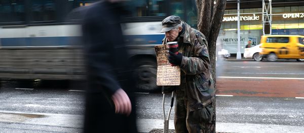 A homeless man begs for donations outside a subway station in New York on February 4, 2015 A homeless man begs for donations outside a subway station in New York on February 4, 2015 - Sputnik International