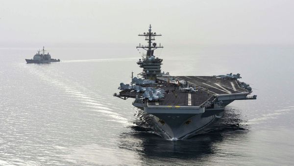The aircraft carrier USS Theodore Roosevelt (CVN 71) and the guided-missile cruiser USS Normandy (CG) 60 sail in the Arabian Sea, in this U.S. Navy photo taken April 16, 2015 The aircraft carrier USS Theodore Roosevelt (CVN 71) and the guided-missile cruiser USS Normandy (CG) 60 sail in the Arabian Sea, in this U.S. Navy photo taken April 16, 2015 - Sputnik International