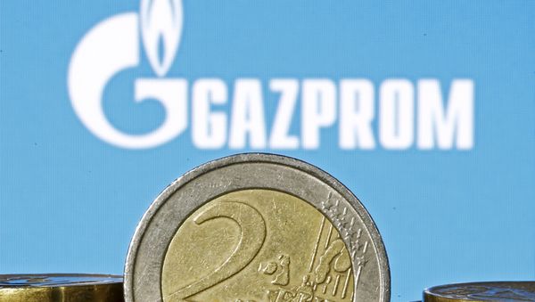 Euro coins are seen in front of displayed logo of Gazprom Euro coins are seen in front of displayed logo of Gazprom - Sputnik International