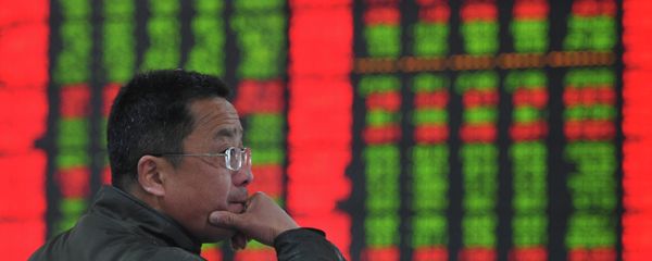A stock investor gestures as he checks share prices at a securities firm in Fuyang, east China's Anhui province - Sputnik International