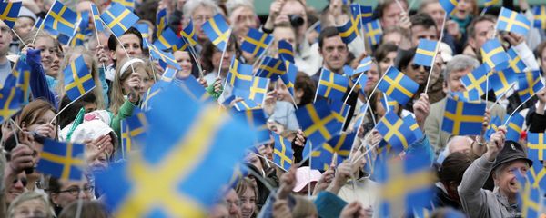 Swedes wave with flags in the Skansen open-air museum in Stockholm 06 June 2005 when the National Day for the first time is celebrated as a national holiday in Sweden Swedes wave with flags in the Skansen open-air museum in Stockholm 06 June 2005 when the National Day for the first time is celebrated as a national holiday in Sweden - Sputnik International