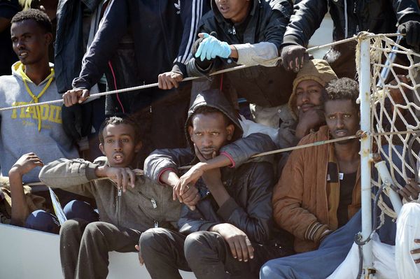 Migrants wait to disembark from the Italian Navy vessel 'Chimera' in the harbor of Salerno, Italy. Migrants wait to disembark from the Italian Navy vessel 'Chimera' in the harbor of Salerno, Italy. - Sputnik International