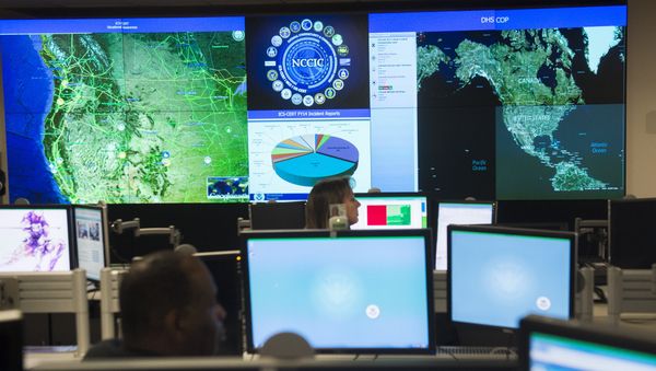Staff members sit at their work stations at the National Cybersecurity and Communications Integration Center in Arlington, Virginia, January 13, 2015 Staff members sit at their work stations at the National Cybersecurity and Communications Integration Center in Arlington, Virginia, January 13, 2015 - Sputnik International