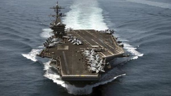 The aircraft carrier USS Theodore Roosevelt (CVN 71) operates in the Arabian Sea conducting maritime security operations in this U.S. April 21, 2015.  - Sputnik International