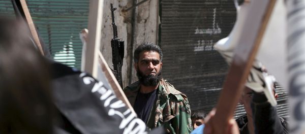 A rebel fighter attends a demonstration celebrating Nusra Front's take over of Idlib about a month ago and calling for the implementation of the Islamic Sharia law, in Al-Sakhour neighborhood of Aleppo - Sputnik International