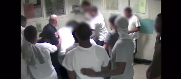 A screenshot of a Rikers CCTV video showing a corrections officer and inmates beating Kalief Browder A screenshot of a Rikers CCTV video showing a corrections officer and inmates beating Kalief Browder - Sputnik International