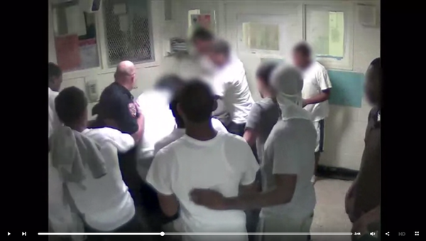 A screenshot of a Rikers CCTV video showing a corrections officer and inmates beating Kalief Browder A screenshot of a Rikers CCTV video showing a corrections officer and inmates beating Kalief Browder - Sputnik International