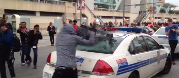 Screenshot from cell phone video that shows a protester smash a police car window during an anti-police brutality rally in Baltimore on April 25, 2015 Screenshot from cell phone video that shows a protester smash a police car window during an anti-police brutality rally in Baltimore on April 25, 2015 - Sputnik International