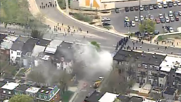 Baltimore riot police deploy smoke canisters to ward off angry protesters. Baltimore riot police deploy smoke canisters to ward off angry protesters. - Sputnik International