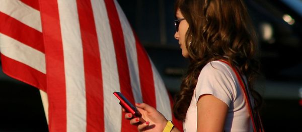 A woman uses a cell phone A woman uses a cell phone - Sputnik International
