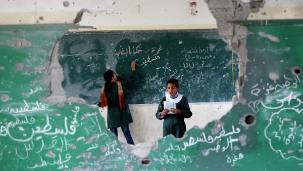 Palestinian girls play inside their school which was destroyed during the 50 days of conflict between Israel and Hamas last summer, in the Shejaiya neighborhood of Gaza City, on November 5, 2014 Palestinian girls play inside their school which was destroyed during the 50 days of conflict between Israel and Hamas last summer, in the Shejaiya neighborhood of Gaza City, on November 5, 2014 - Sputnik International