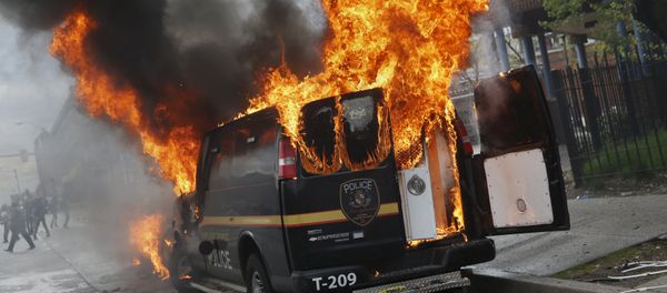 A Baltimore Metropolitan Police transport vehicle burns during clashes in Baltimore, Maryland April 27, 2015 A Baltimore Metropolitan Police transport vehicle burns during clashes in Baltimore, Maryland April 27, 2015 - Sputnik International