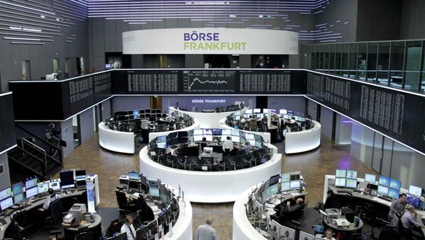 Traders are pictured at their desks in front of the DAX board at the Frankfurt stock exchange April 15, 2015 Traders are pictured at their desks in front of the DAX board at the Frankfurt stock exchange April 15, 2015 - Sputnik International
