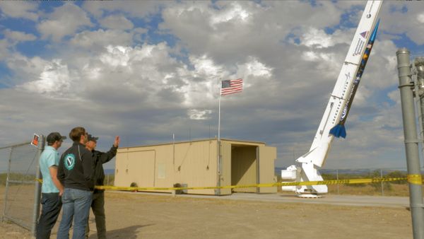 Representatives of Ninkasi Brewing Company eye a rocket carrying beer-making yeast before its October 23, 2014, launch into space. Representatives of Ninkasi Brewing Company eye a rocket carrying beer-making yeast before its October 23, 2014, launch into space. - Sputnik International