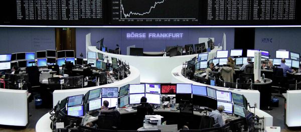 Traders are pictured at their desks in front of the DAX board at the Frankfurt stock exchange April 27, 2015 Traders are pictured at their desks in front of the DAX board at the Frankfurt stock exchange April 27, 2015 - Sputnik International