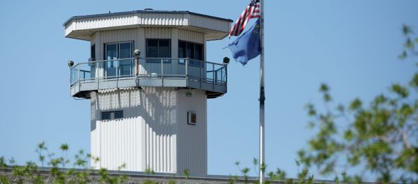 Flags fly near a guard tower at High Desert State Prison Wednesday, April 15, 2015, in Indian Springs, Nev - Sputnik International