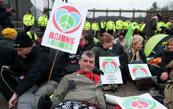 Protesters calling for an end to the Trident nuclear programme holds placards at a blockade in the road in front of HM Naval Base Clyde in Faslane, Scotland, northeast of Glasgow, on April 13, 2015 the UK base for Trident Protesters calling for an end to the Trident nuclear programme holds placards at a blockade in the road in front of HM Naval Base Clyde in Faslane, Scotland, northeast of Glasgow, on April 13, 2015 the UK base for Trident - Sputnik International