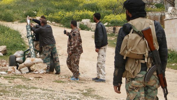 Free Syrian Army fighters of the 101 Infantry Division (the missile and artillery battalion) prepare to fire a mortar from Jabal al-Arbaeen towards al-Fanar checkpoint in Ariha, which is controlled by forces loyal to Syria's President Bashar al-Assad, in Idlib countryside April 16, 2015 - Sputnik International
