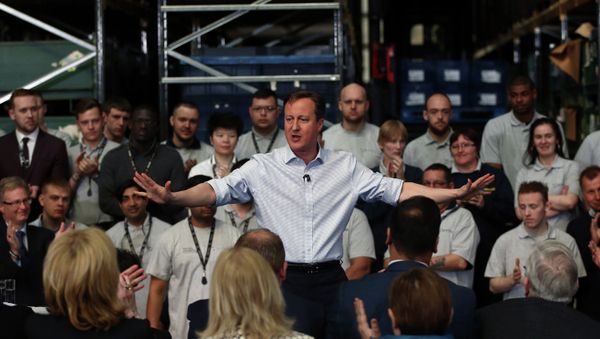 Britain's Prime Minister and leader of the Conservative party David Cameron (C) makes a speech during a UK general election campaign visit to an engineering factory in Birmingham on April 29, 2015 Britain's Prime Minister and leader of the Conservative party David Cameron (C) makes a speech during a UK general election campaign visit to an engineering factory in Birmingham on April 29, 2015 - Sputnik International