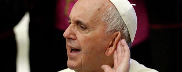 Pope Francis tries to hear during an audience with the members of Cursillos of Christianity movement in the Paul VI hall at the Vatican on April 30, 2015 - Sputnik International