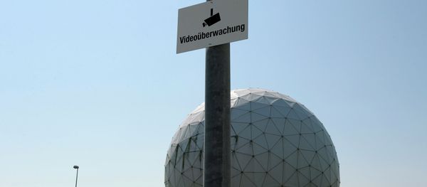 A photo taken on July 16, 2013 shows a sign reading video surveillance fixed to a lamp post in front of radomes of the former monitoring base of the US intelligence organization National Security Agency (NSA) in Bad Aibling, southern Germany A photo taken on July 16, 2013 shows a sign reading video surveillance fixed to a lamp post in front of radomes of the former monitoring base of the US intelligence organization National Security Agency (NSA) in Bad Aibling, southern Germany - Sputnik International