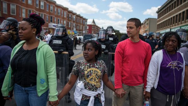 From left, Adrienne Horton, 11 year-old Shenya Milford, Vinny Bevivino, and Lakia McDaniel, all from Baltimore, Md., gather to sing Amazing Grace during a gathering of demonstrators after an evening of riots following the funeral of Freddie Gray on Tuesday, April 28, 2015, in Baltimore From left, Adrienne Horton, 11 year-old Shenya Milford, Vinny Bevivino, and Lakia McDaniel, all from Baltimore, Md., gather to sing Amazing Grace during a gathering of demonstrators after an evening of riots following the funeral of Freddie Gray on Tuesday, April 28, 2015, in Baltimore - Sputnik International