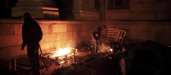 Pro-Ukrainian supporters sort through rubbish outside the burnt trade union building where more than 30 people died trying to escape during clashes in Odessa, Ukraine, on Friday, May 2, 2014 Pro-Ukrainian supporters sort through rubbish outside the burnt trade union building where more than 30 people died trying to escape during clashes in Odessa, Ukraine, on Friday, May 2, 2014 - Sputnik International