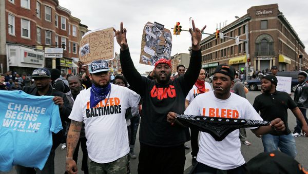 A man who calls himself Goldie Loc, center left, walks with a man who calls himself Wolfe, center, right, celebrating on Friday, May 1, 2015. - Sputnik International