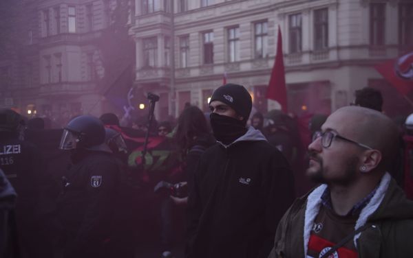 A protester wears a mask while flares are used during the 'Revolutionary' May Day demonstration in Berlin on May 1, 2015. A protester wears a mask while flares are used during the 'Revolutionary' May Day demonstration in Berlin on May 1, 2015. - Sputnik International
