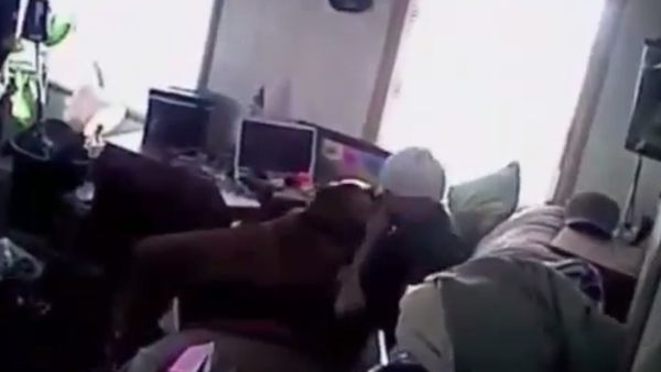 Police body-cam footage released as part of a lawsuit shows officers from the West Jordan Police Department in Utah siccing their dog on a man as he sits on his sofa with his hands raised. - Sputnik International