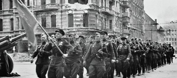Soviet soldiers marching at the May 1 parade in Berlin Soviet soldiers marching at the May 1 parade in Berlin - Sputnik International