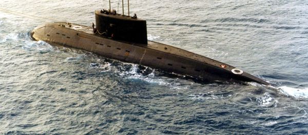 A Russian-built, Kilo-class diesel submarine recently purchased by Iran, is towed by a support vessel in this photograph taken in the central Mediterranean Sea - Sputnik International