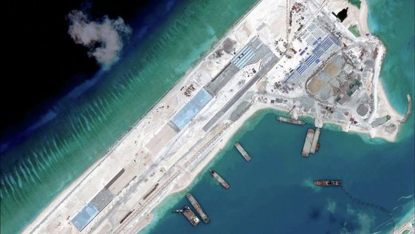 Airstrip construction on the Fiery Cross Reef in the South China Sea is pictured in this April 2, 2015 handout satellite image obtained by Reuters on April 16, 2015 Airstrip construction on the Fiery Cross Reef in the South China Sea is pictured in this April 2, 2015 handout satellite image obtained by Reuters on April 16, 2015 - Sputnik International