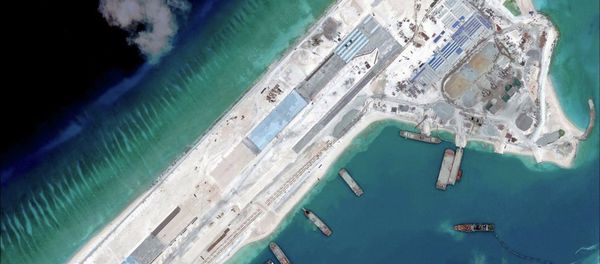 Airstrip construction on the Fiery Cross Reef in the South China Sea is pictured in this April 2, 2015 handout satellite image obtained by Reuters on April 16, 2015 Airstrip construction on the Fiery Cross Reef in the South China Sea is pictured in this April 2, 2015 handout satellite image obtained by Reuters on April 16, 2015 - Sputnik International