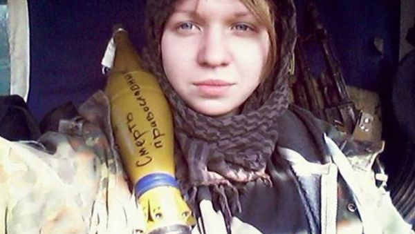 Vita Zaverukha, seen here posing with an RPG shell reading Death to the Orthodox, has been arrested in connection with the murder of two police officers in Kiev. - Sputnik International