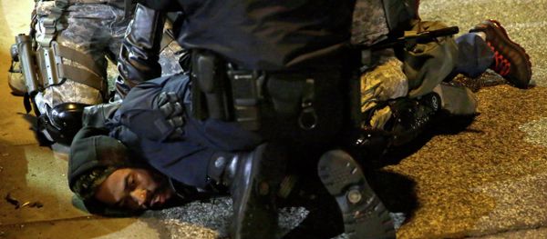 A protester is taken into custody in Ferguson, Mo. A protester is taken into custody in Ferguson, Mo. - Sputnik International